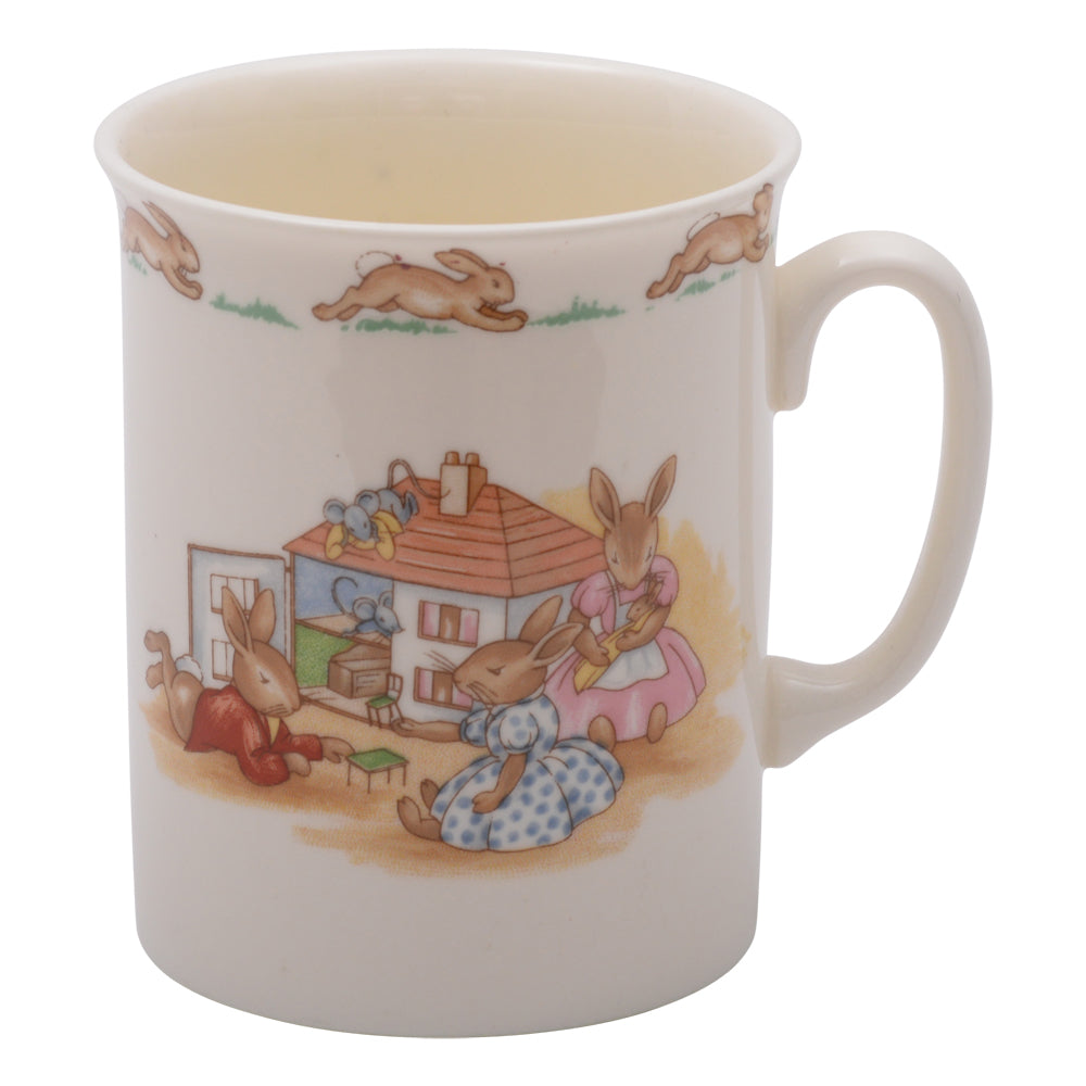 Playing next to small bunnykin mug
