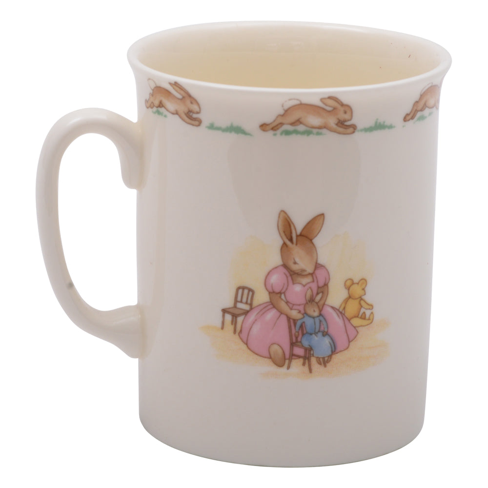 Playing next to small bunnykin mug