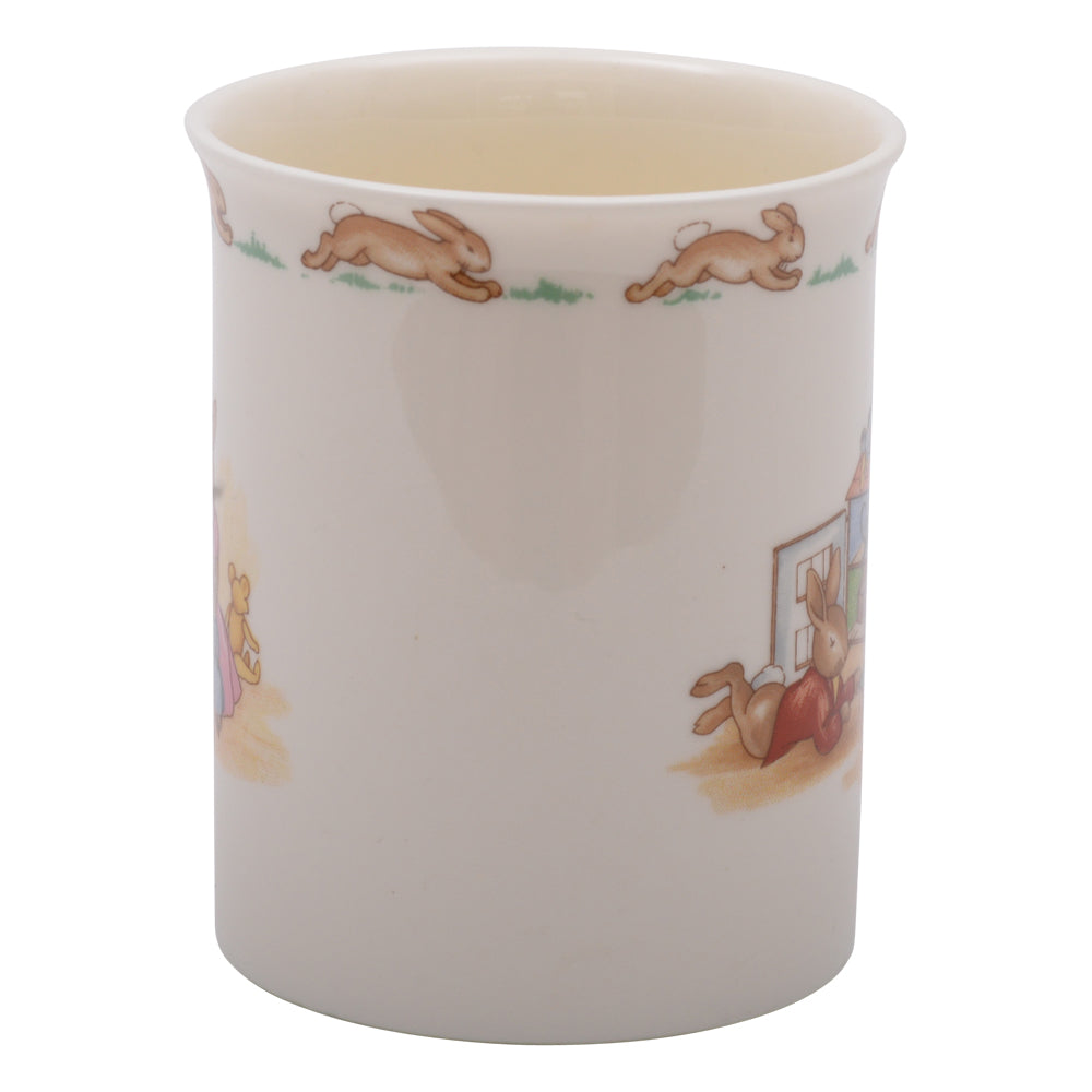 Playing next to small bunnykin mug