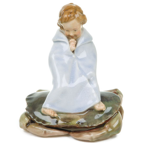 Child on crab figurine