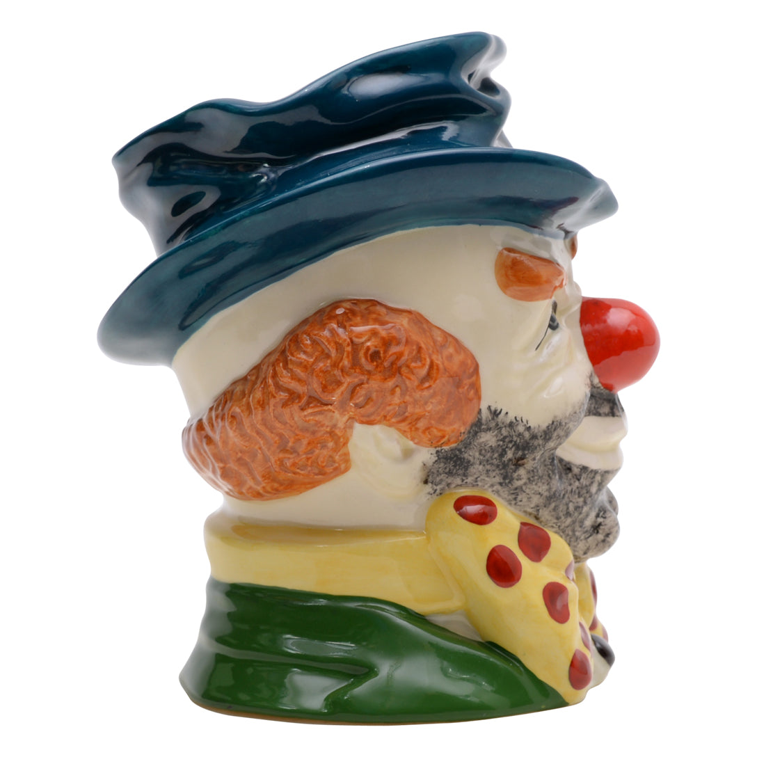 Clown teal hat yellow and red bow tie white glove and orange hair