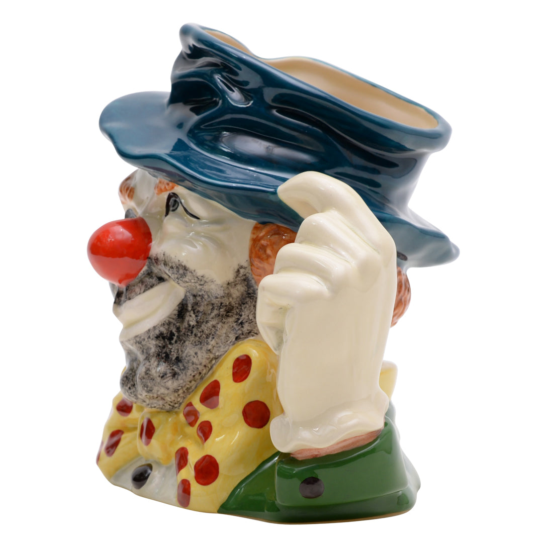 Clown teal hat yellow and red bow tie white glove and orange hair