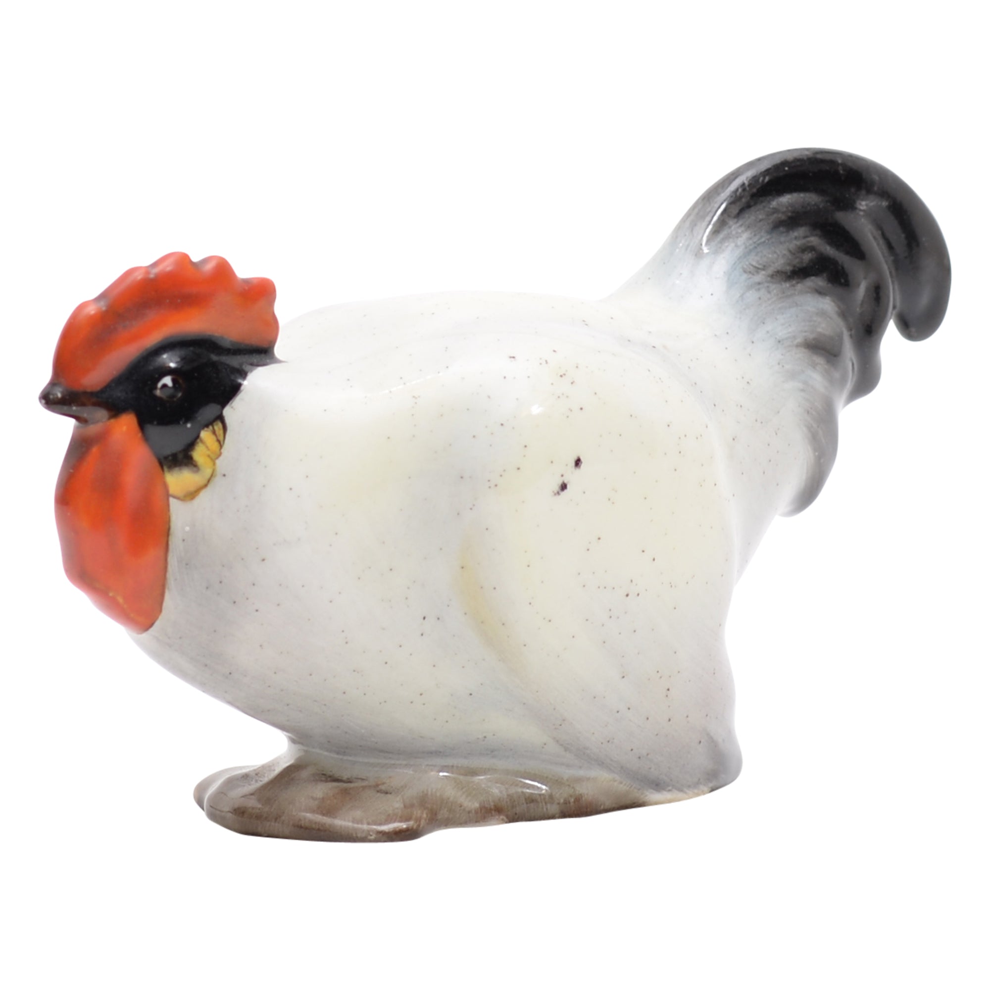 Cockerel crouching animal figurine