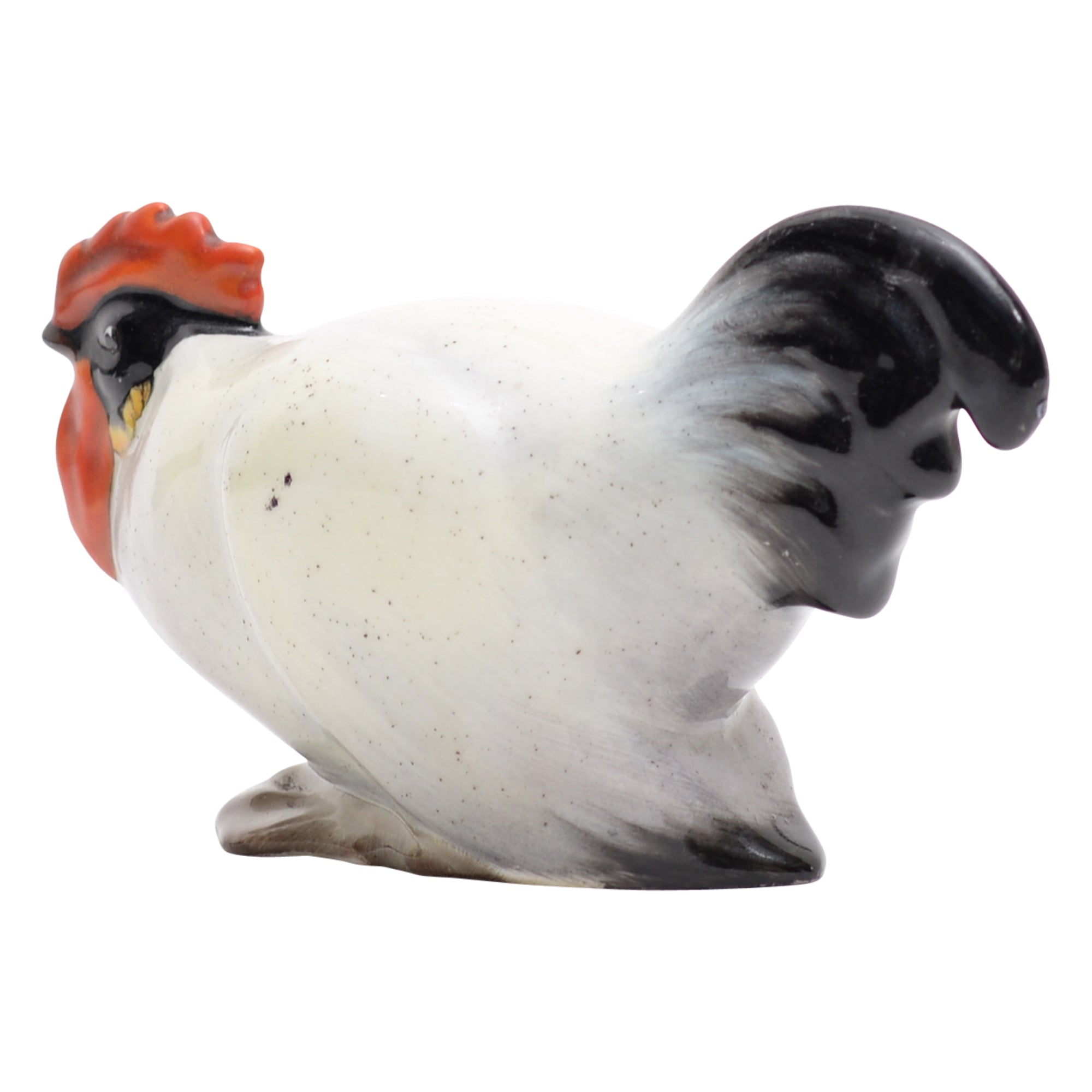 Cockerel crouching animal figurine