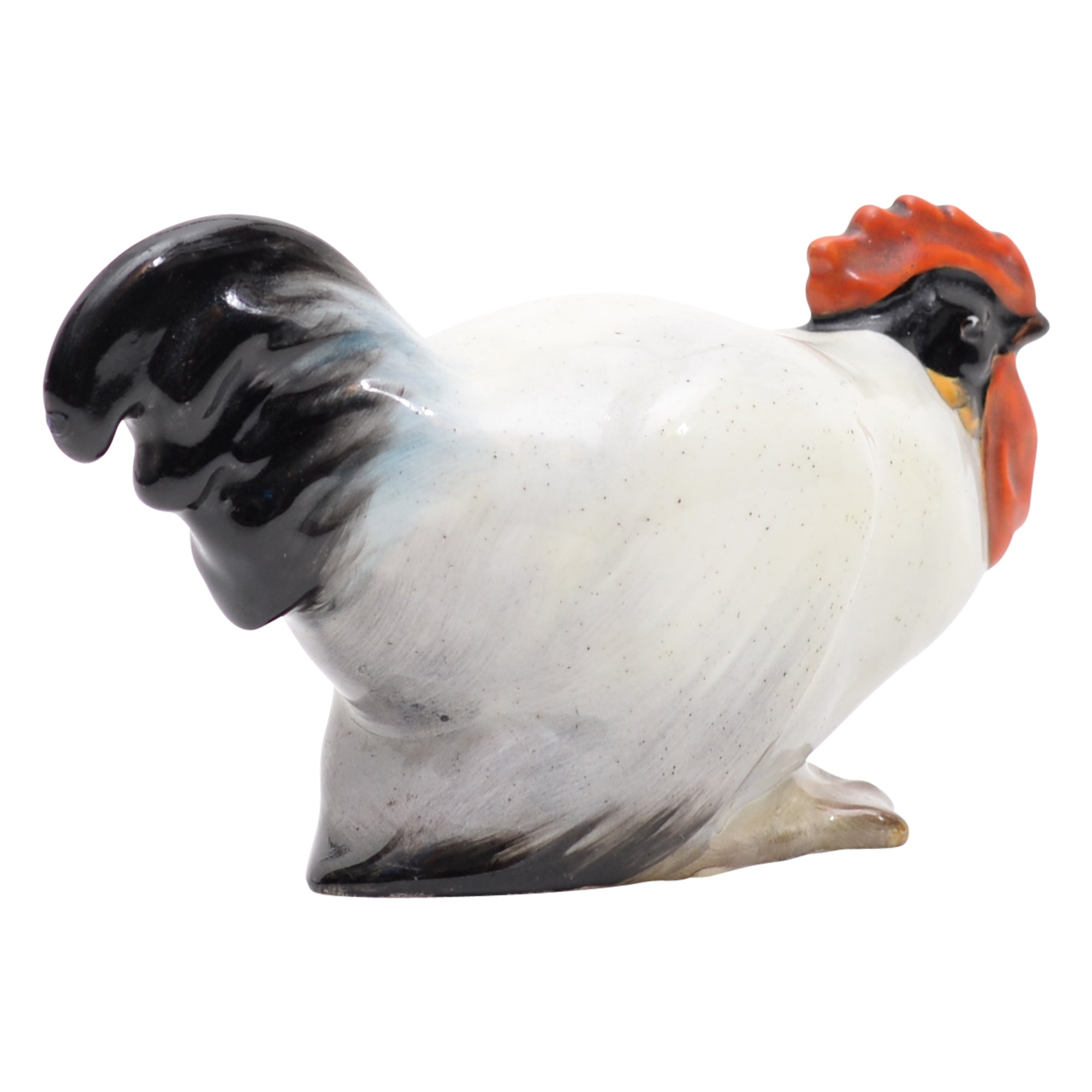 Cockerel crouching animal figurine