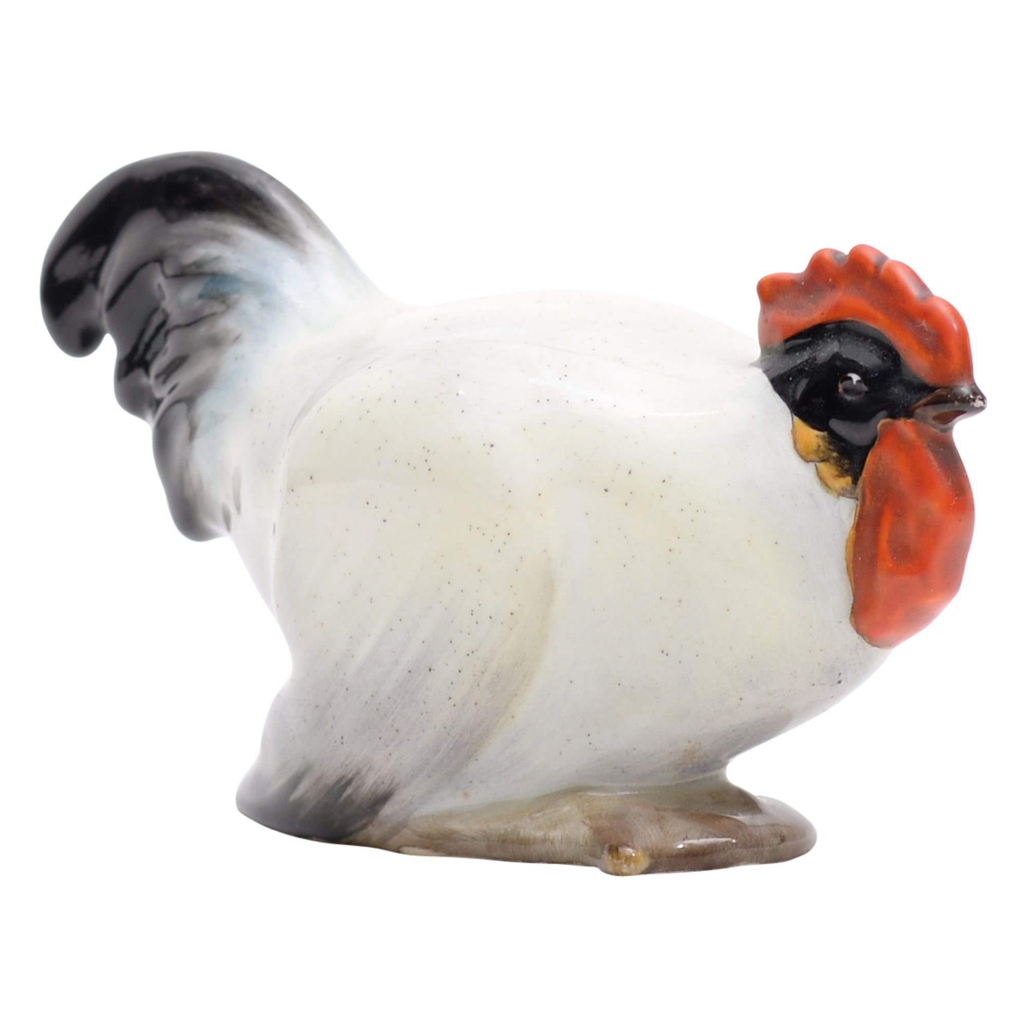 Cockerel crouching animal figurine
