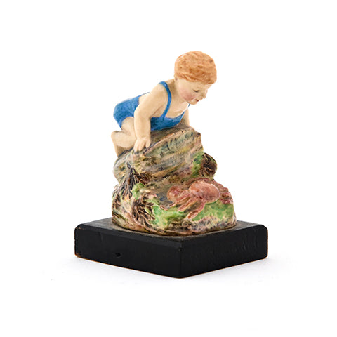 Dulwich figure,child on rock looking at a crab,h. 2.25"