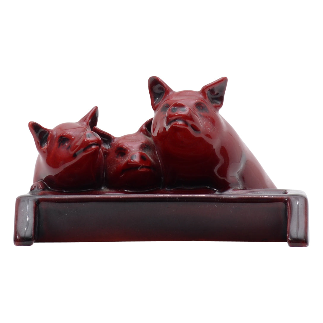 Three pig flambe sculpture