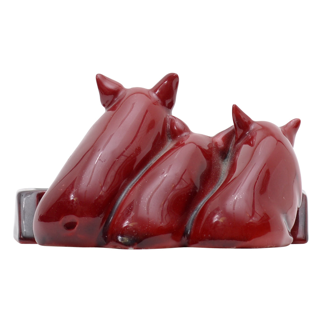 Three pig flambe sculpture