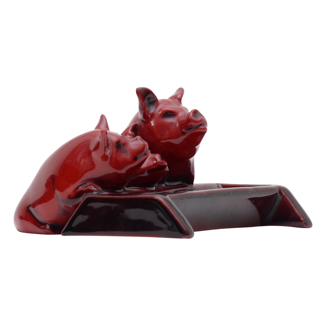 Three pig flambe sculpture