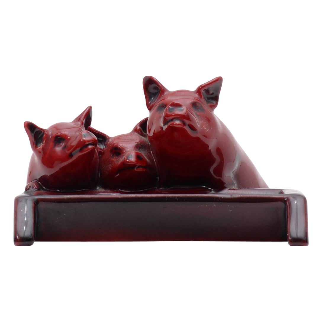 Three pig flambe sculpture