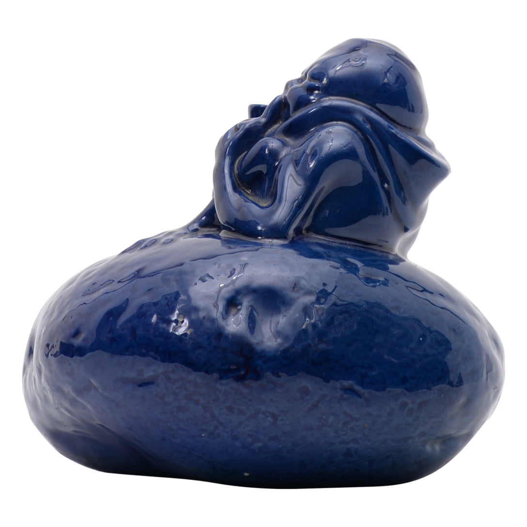 Grotesque man on blue potato