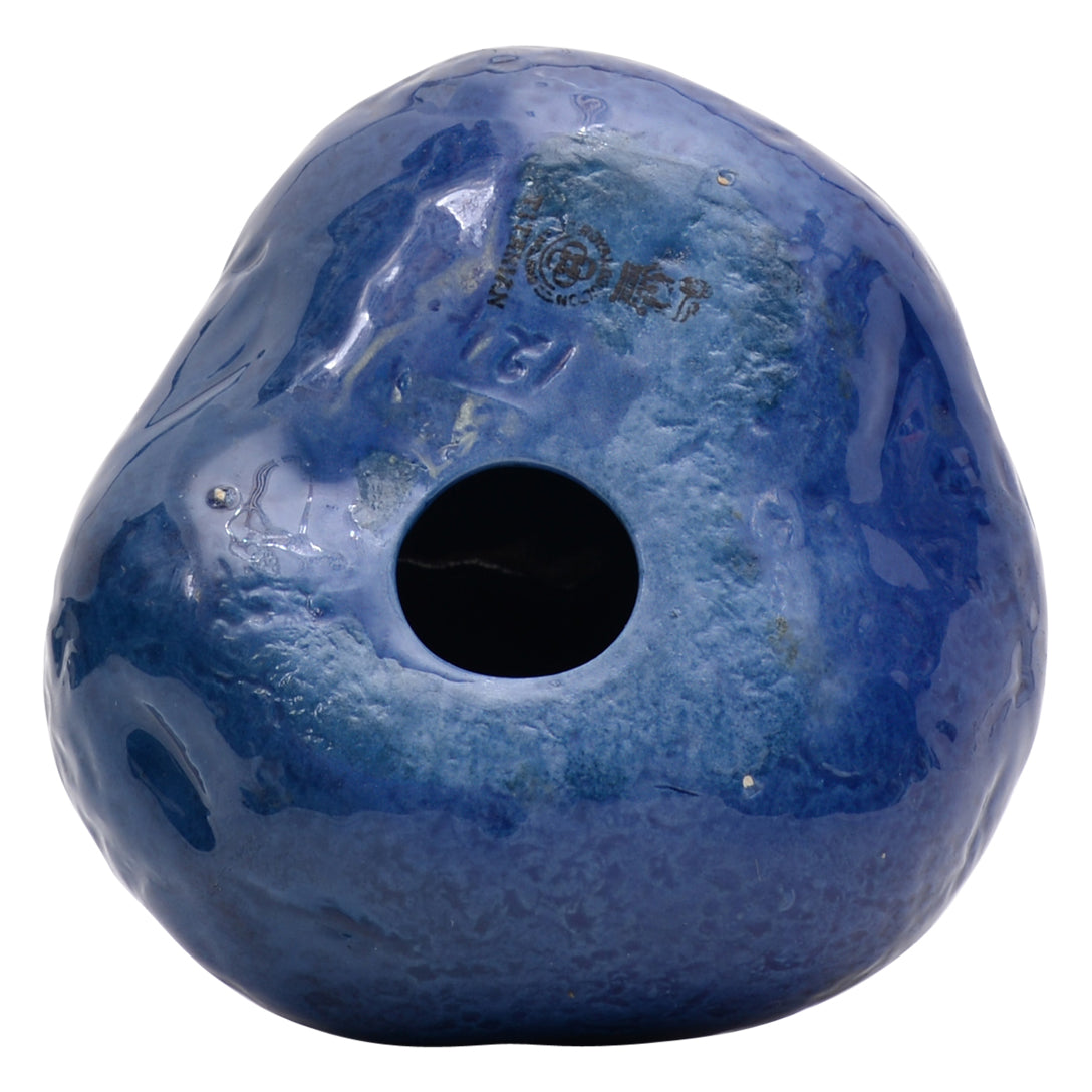 Grotesque man on blue potato