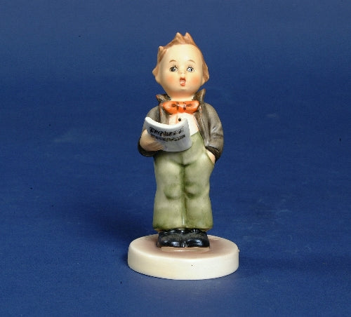 Hummel,boy,stands hand in pocket, holds sheet music,
