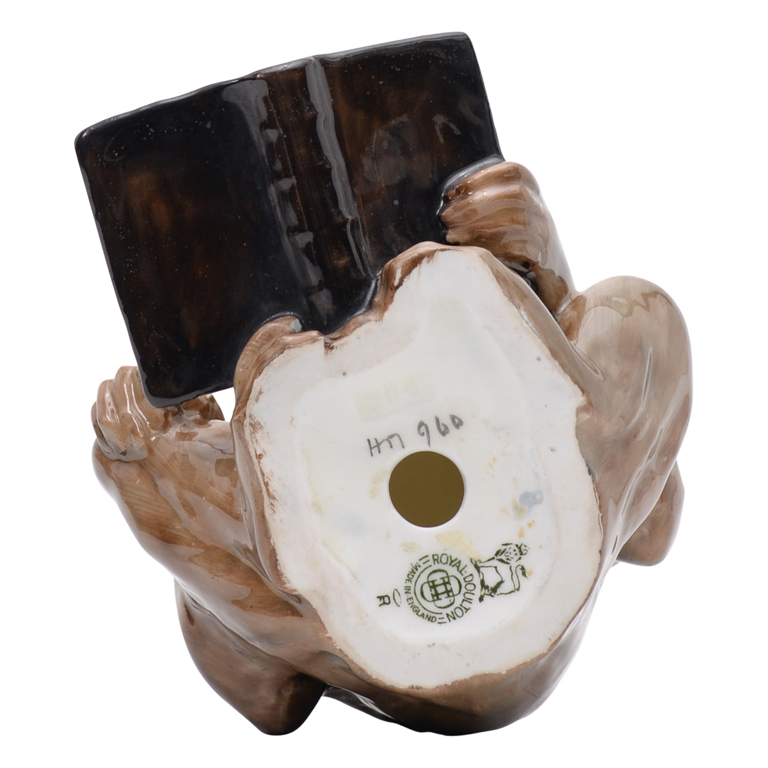 Monkey reading a book sculpture