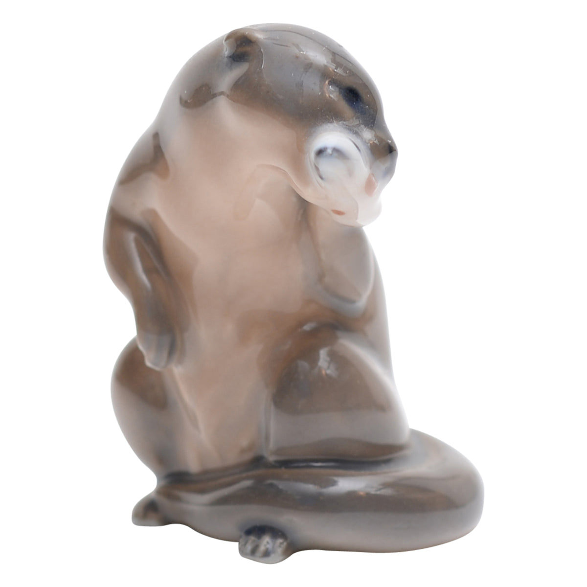 Otter with fish figurine