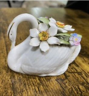 Swan with flowers sculpture