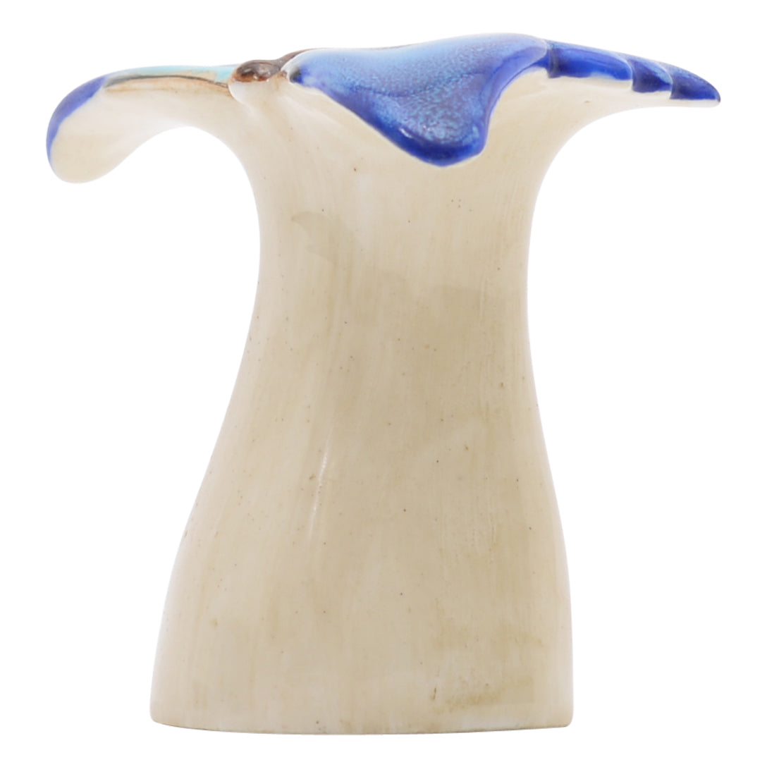 Blue butterfly on pedestal sculpture