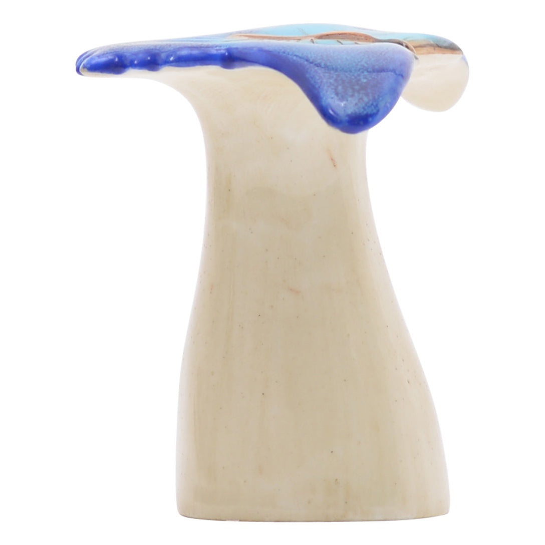 Blue butterfly on pedestal sculpture