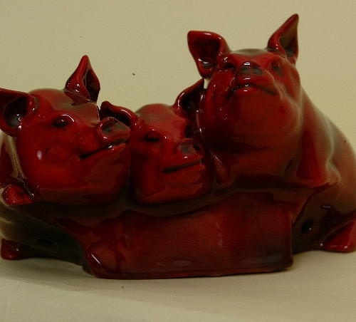 Pigs,flambe,three pigs over edge (no trough)