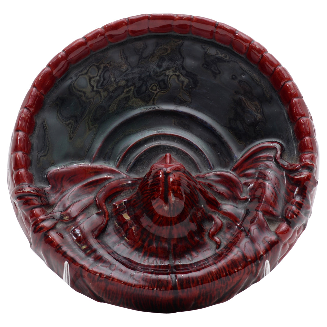 Woman flambe coin dish