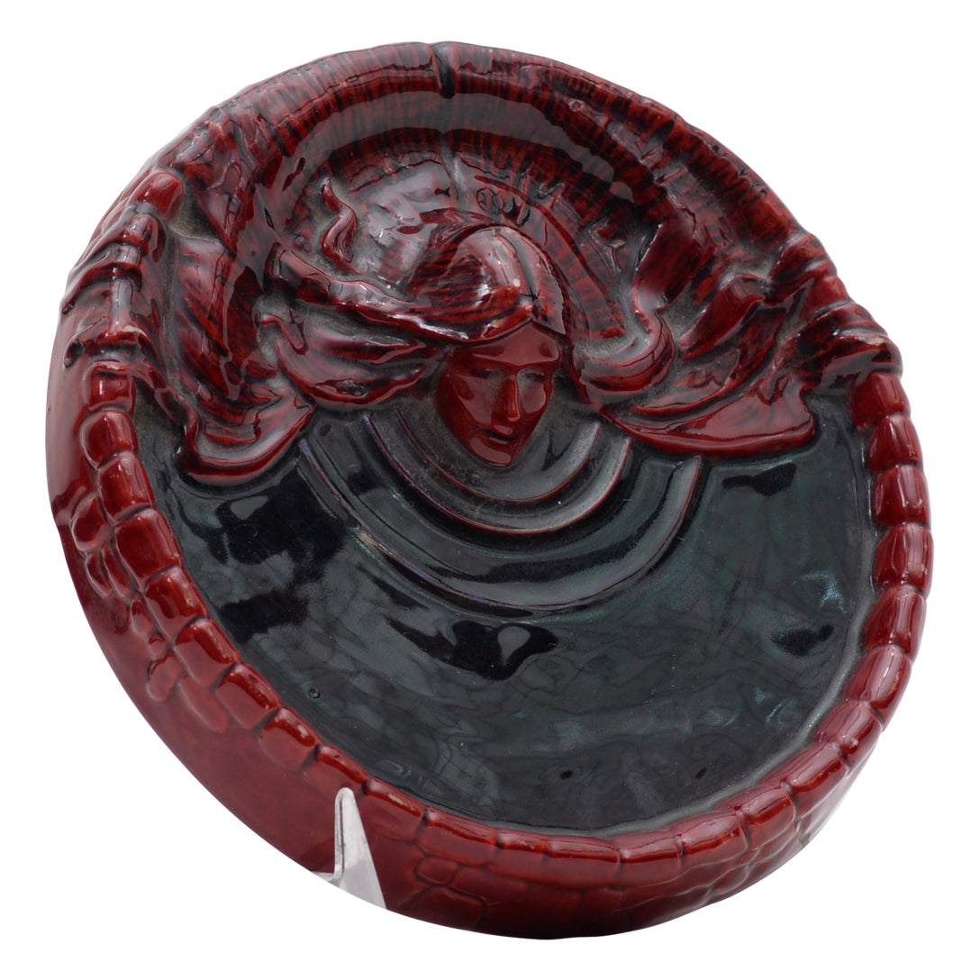 Woman flambe coin dish