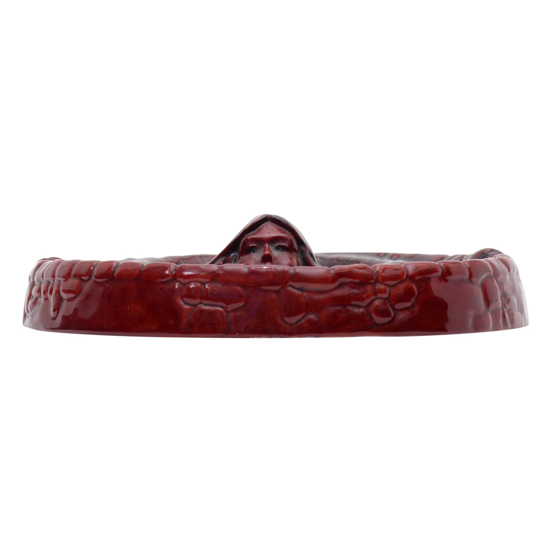 Woman flambe coin dish