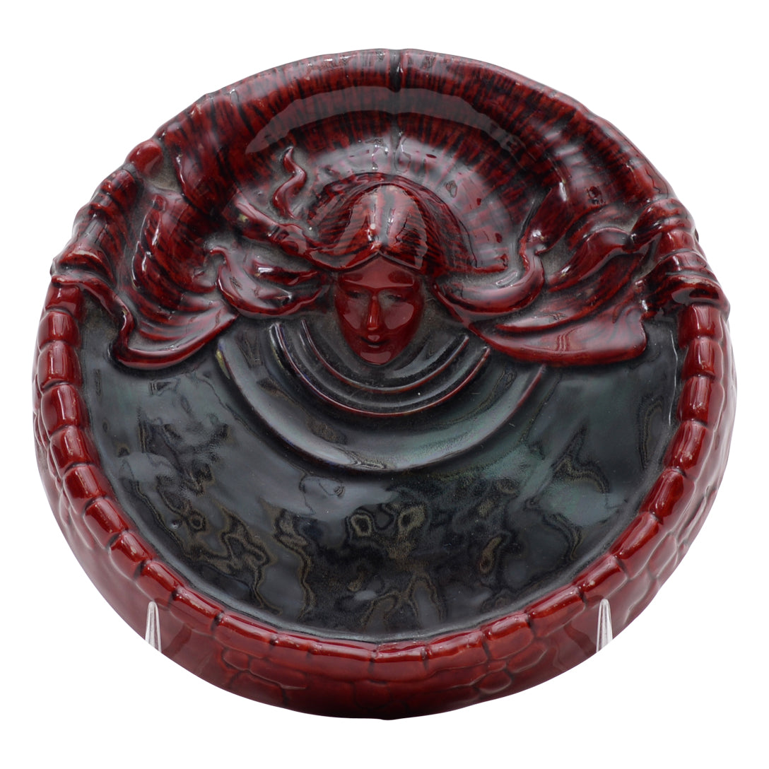 Woman flambe coin dish