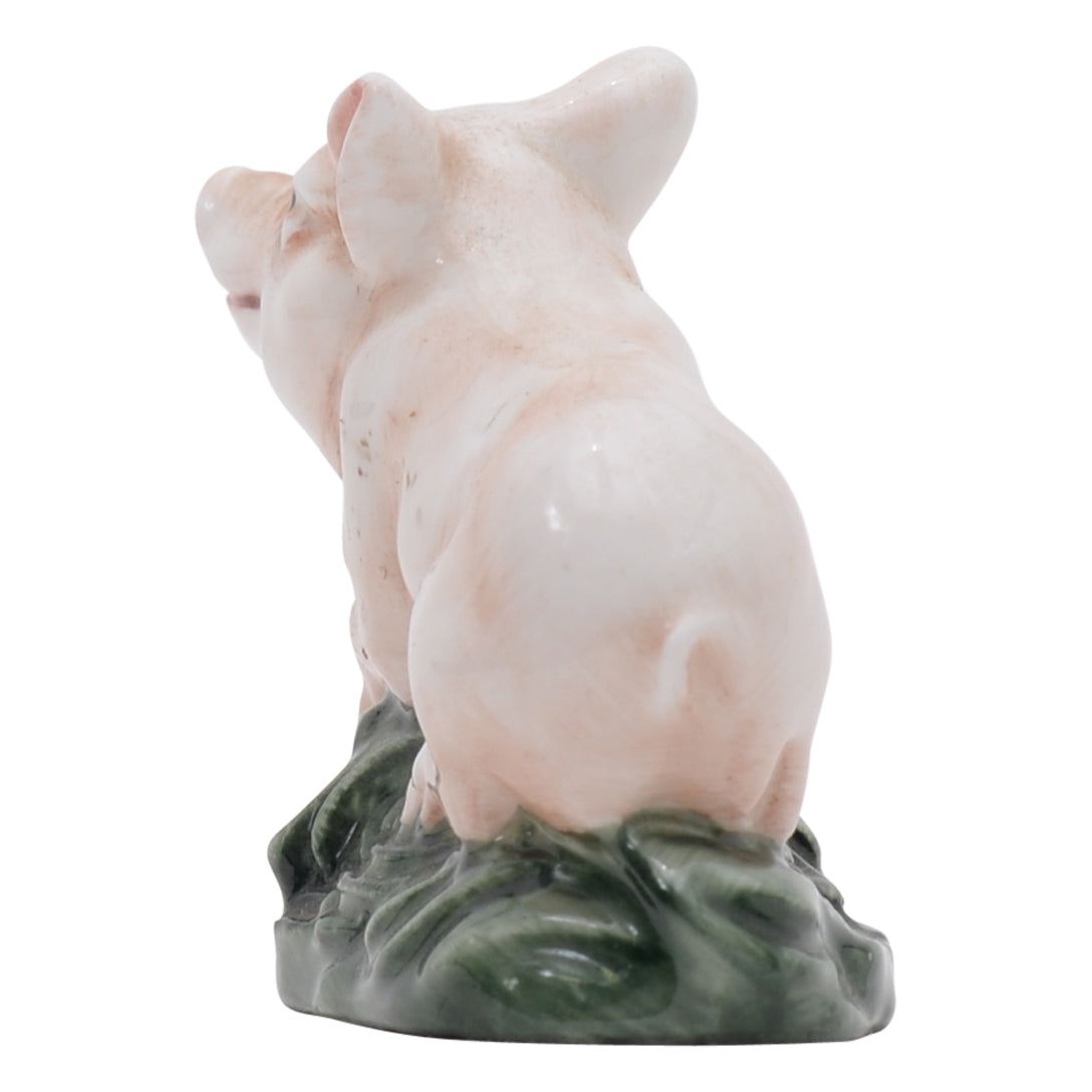 Piglet lying on belly sculpture