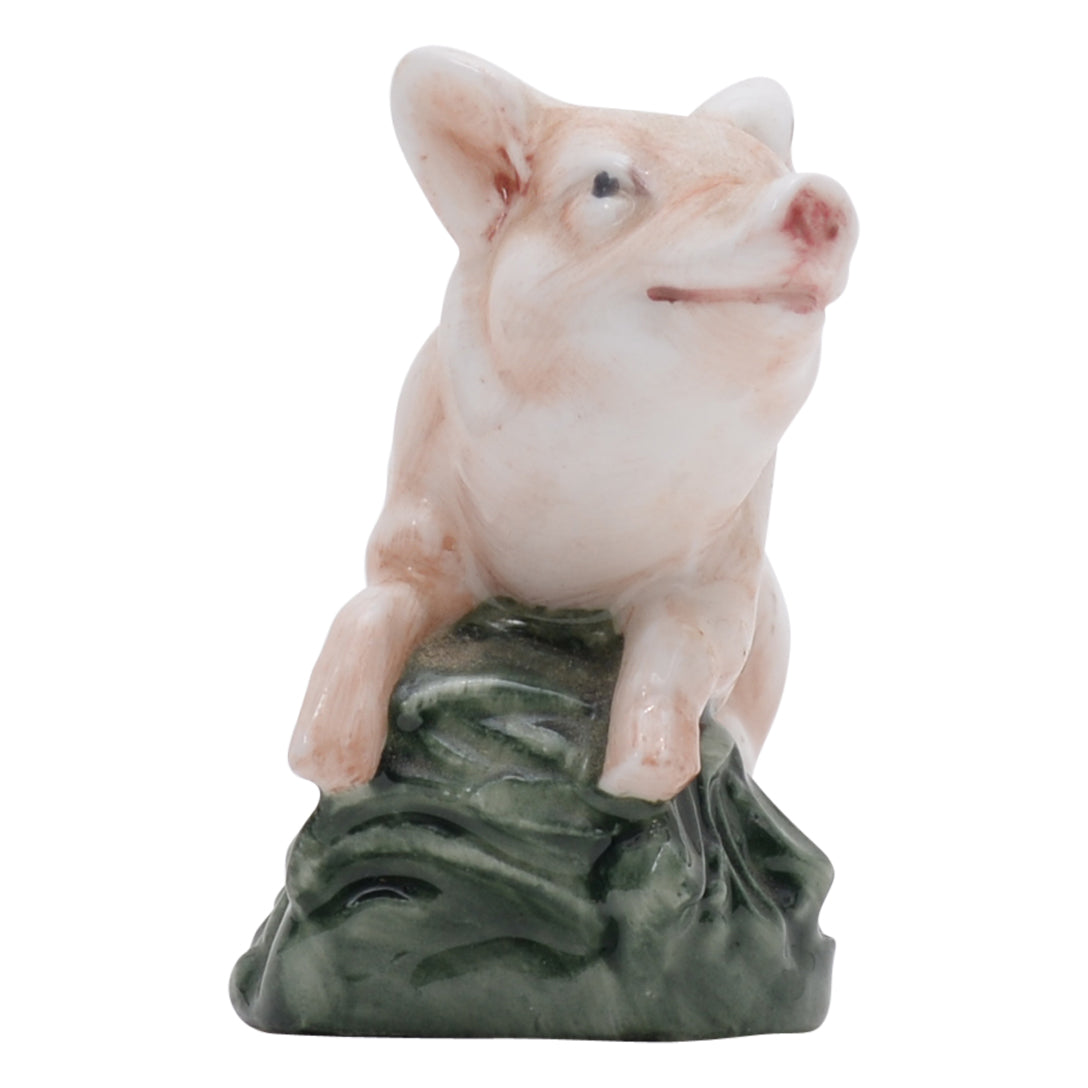 Piglet lying on belly sculpture