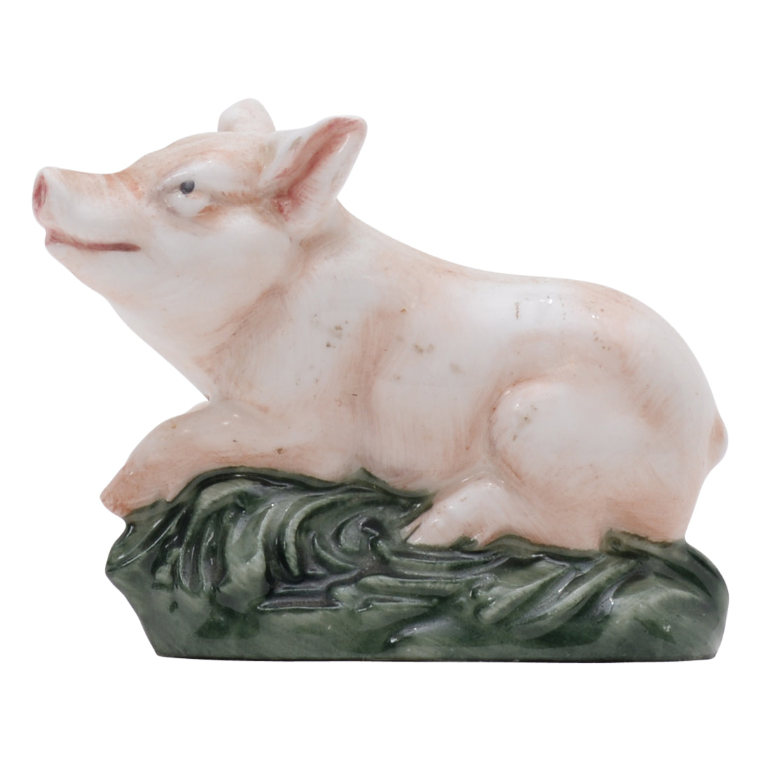Piglet lying on belly sculpture