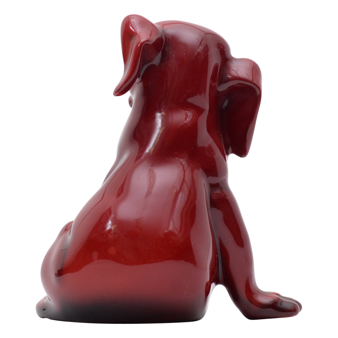 seated puppy flambe sculpture